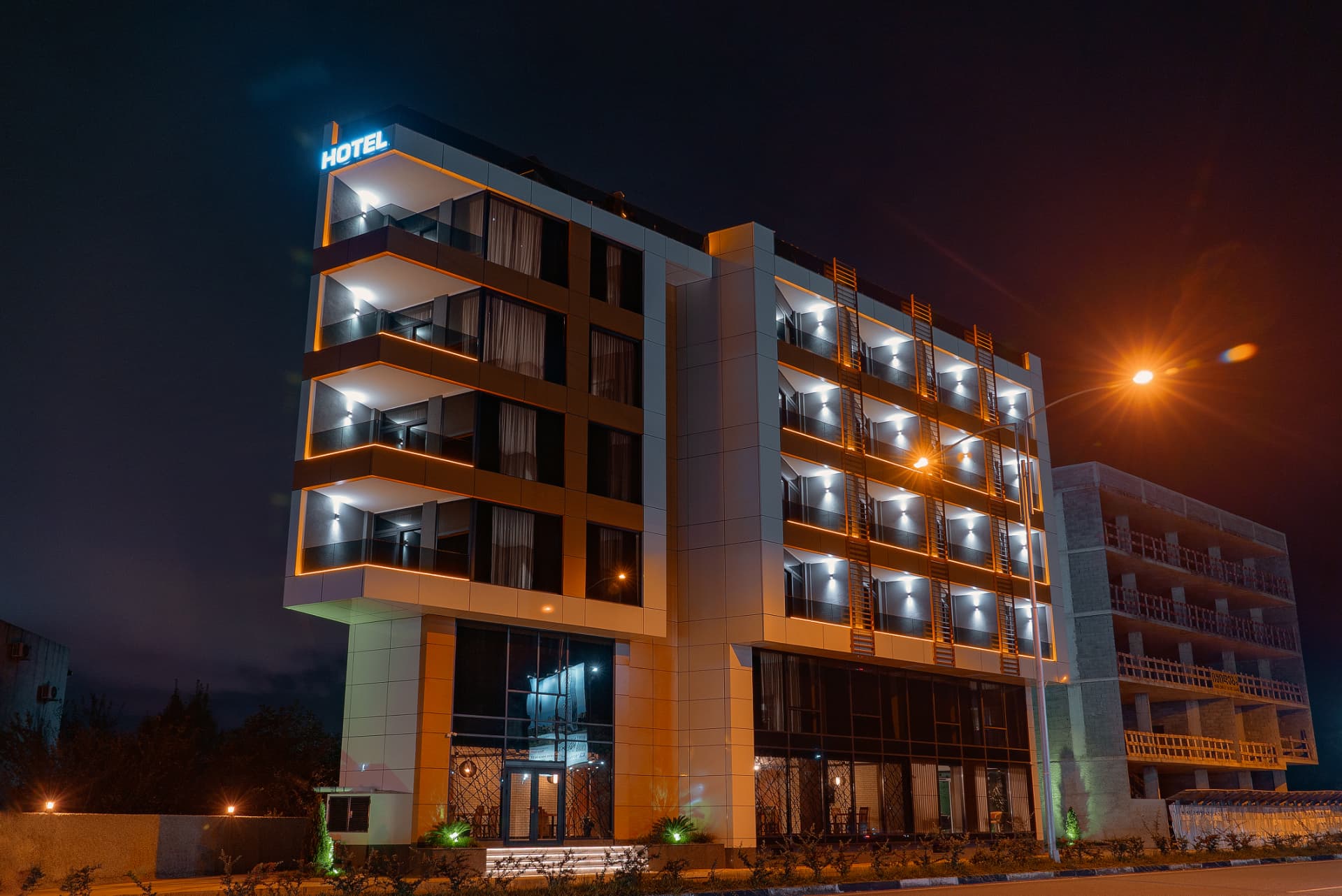 Cozy Loft Hotel illuminated at night