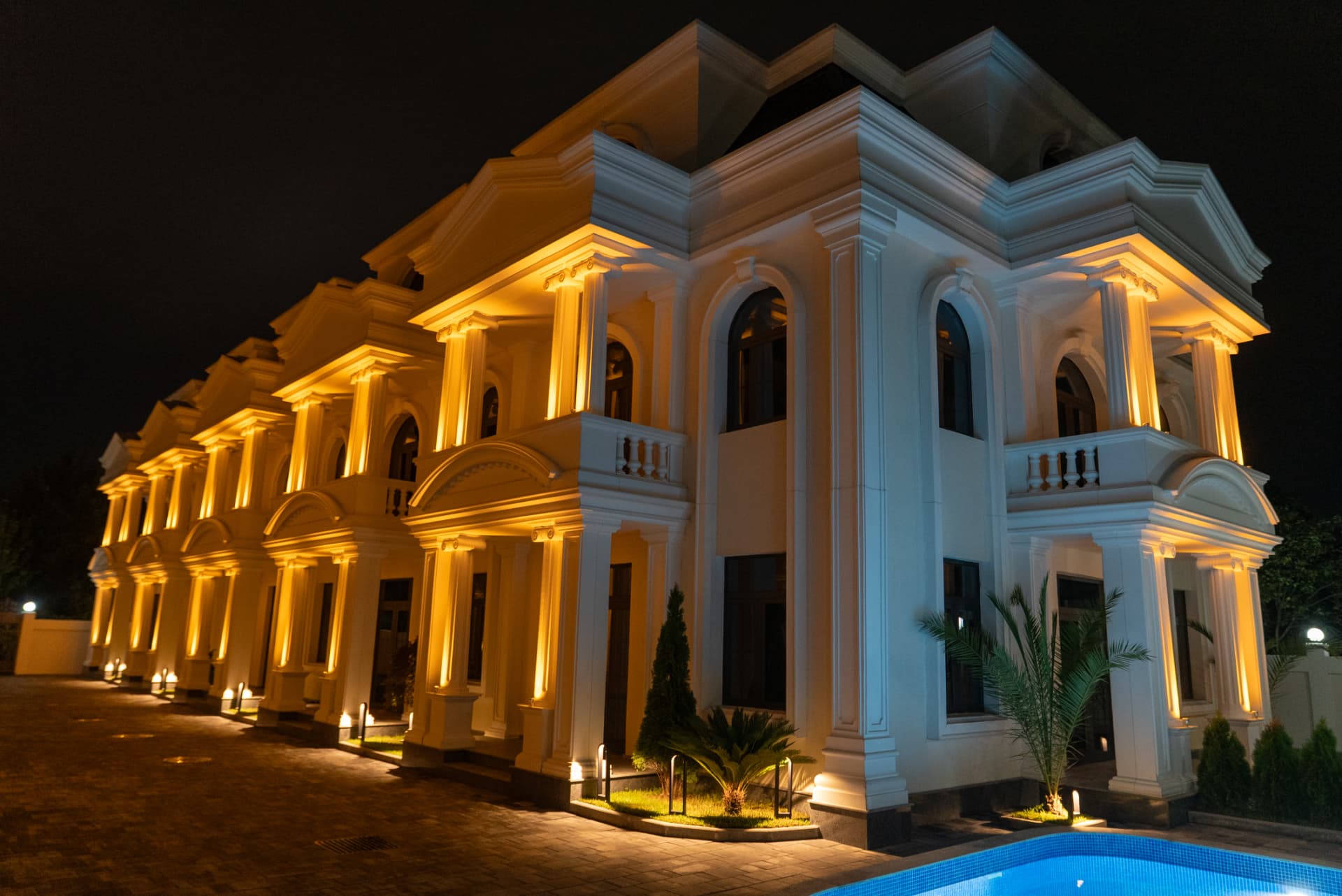 Illuminated villa facade at night
